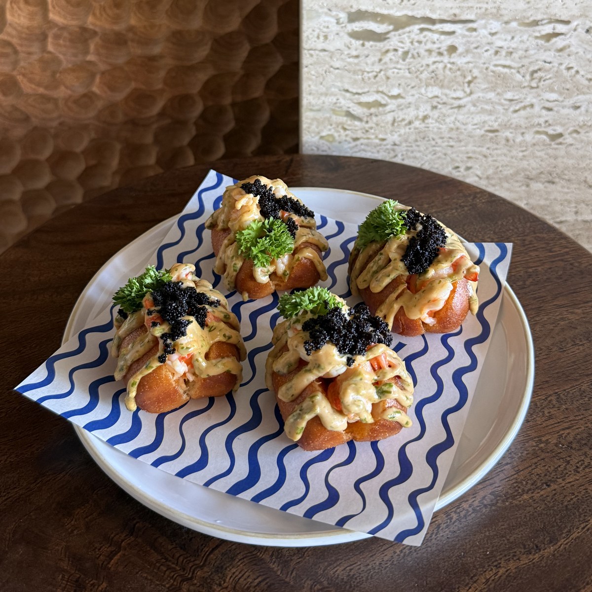 Prawn Rolls in fried bao buns with sriracha dill mayo